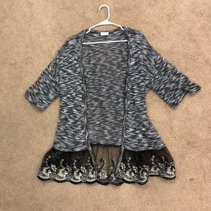 Black, white, and gold sweater